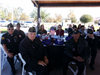 Group of Elderly Veterans Sitting at Table Together at Celebrating Veterans Event