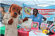 Scruff McGruff Visits with Volunteer at Safety and Readiness Action Team Event