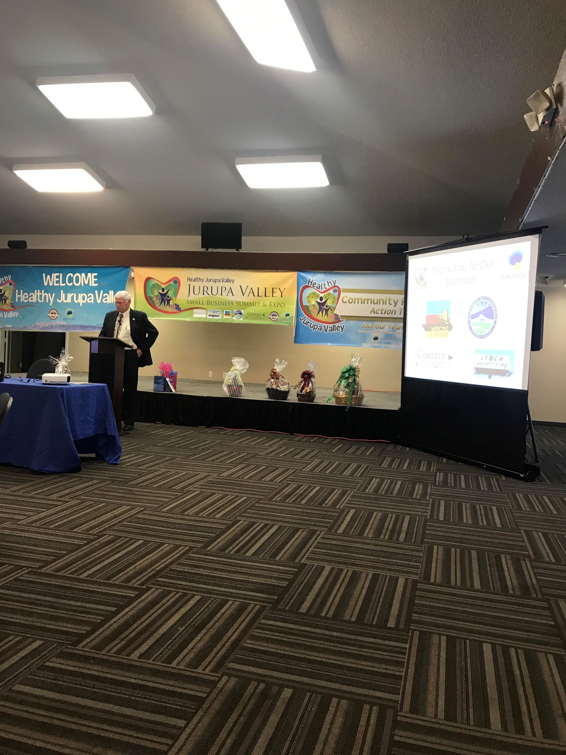 Man at Podium at the Small Business Summit and Expo