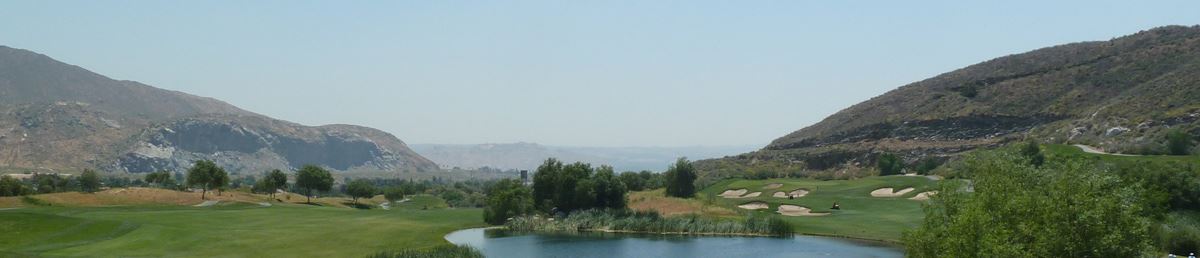 Golf Course Surrounded by Mountains